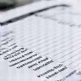 Close up of an automotive service invoice showing clear numbers